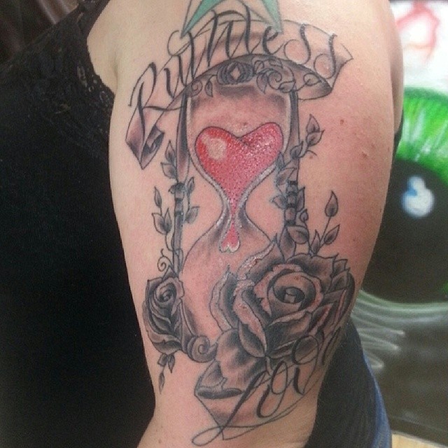 Shoulder hourglass tattoo with roses
