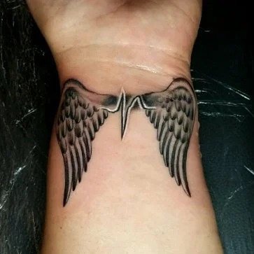 Wrist Heartbeat tattoo with angel wings