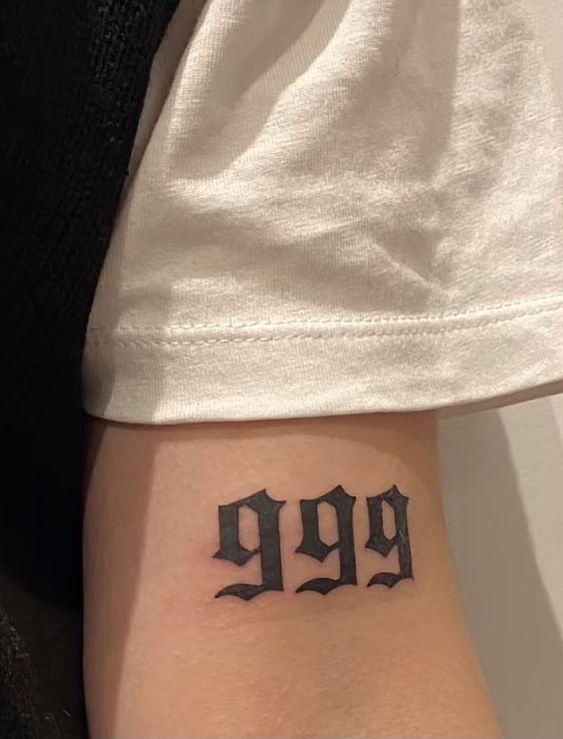 Arm 999 tattoo