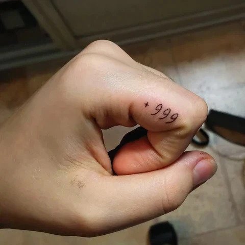 Finger 999 tattoo