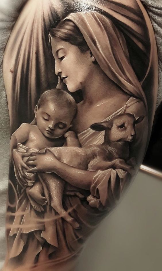 Shoulder Virgin Mary tattoo with a child in her arms