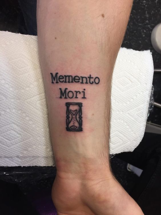 Forearm memento mori tattoo with hourglass