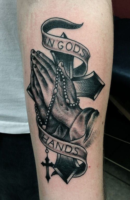 Forearm Praying hands tattoo with cross, rosary and phrase