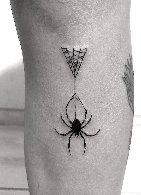 Leg spider web tattoo with spider