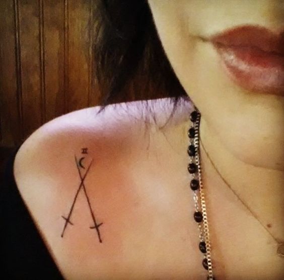 Shoulder two swords tattoo