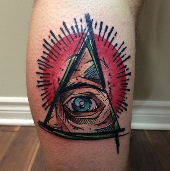 All seeing eye tattoo on the calf