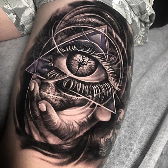 All seeing eye tattoo on the thigh