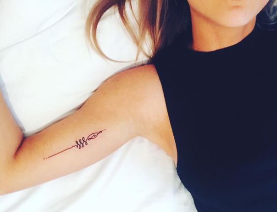 Bicep Unalome tattoo