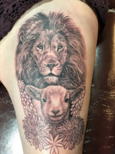 Why not check these extraordinary realistic lion and lamb tattoos 5