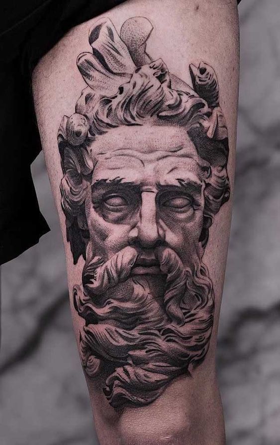 Zeus tattoo on the thigh