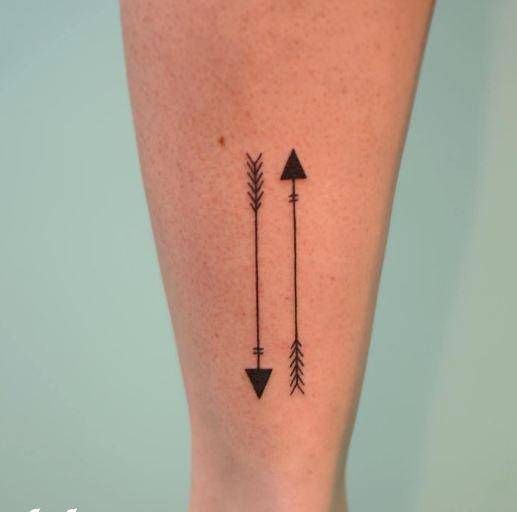 Two Arrows calf tattoo