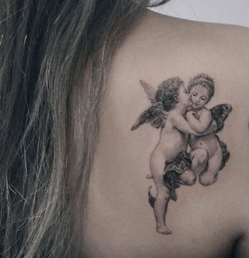 Cherub tattoo on the back