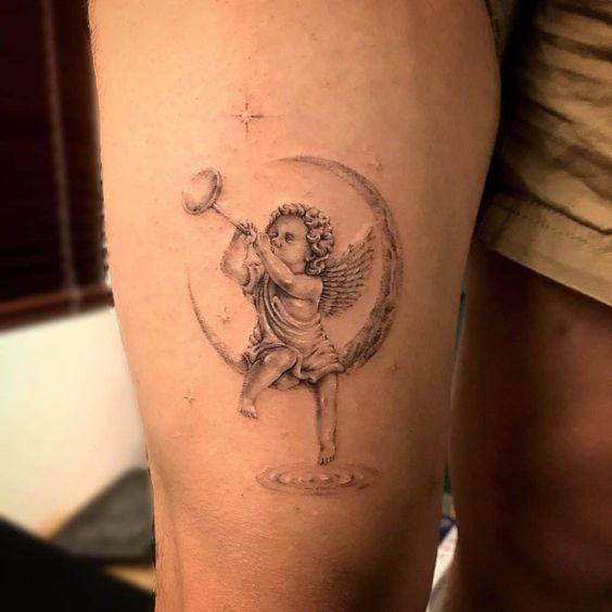 Cherub thigh tattoo