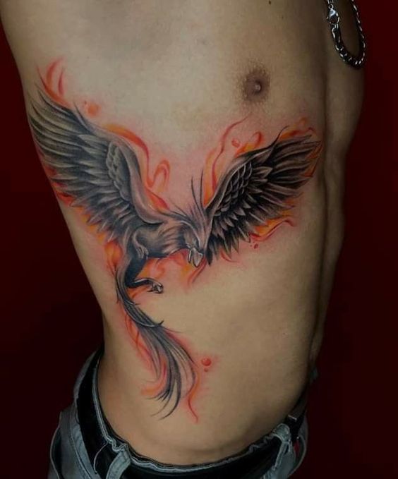 Phoenix Flame tattoo on the ribs