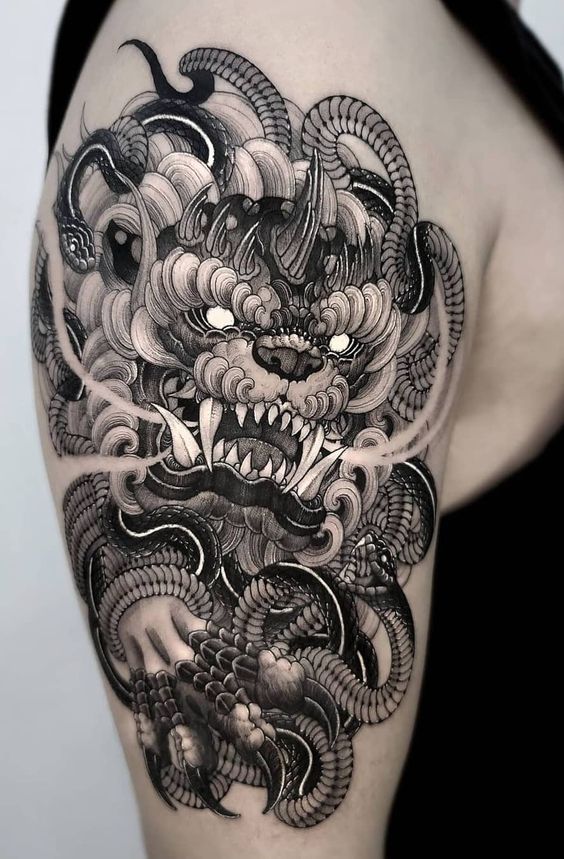 Shoulder black and white Foo dog tattoo