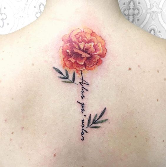 watercolor Marigold back tattoo 