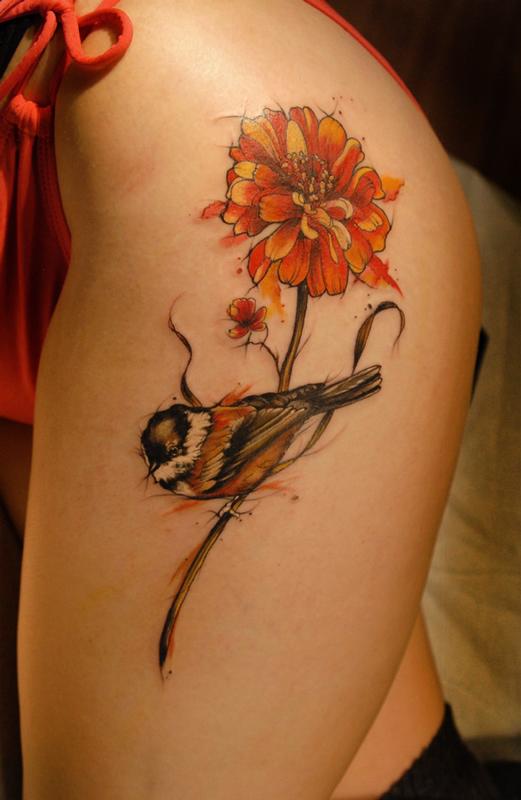 watercolor Marigold ribs tattoo 
