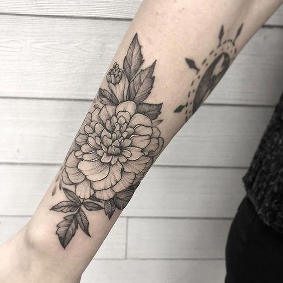 Forearm black and grey Marigold tattoo 