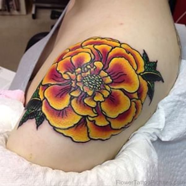Old school Marigold shoulder tattoo 