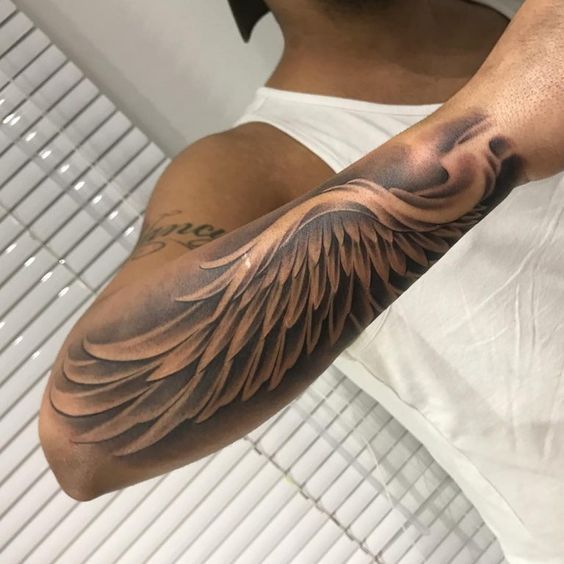 Forearm angel wing tattoo