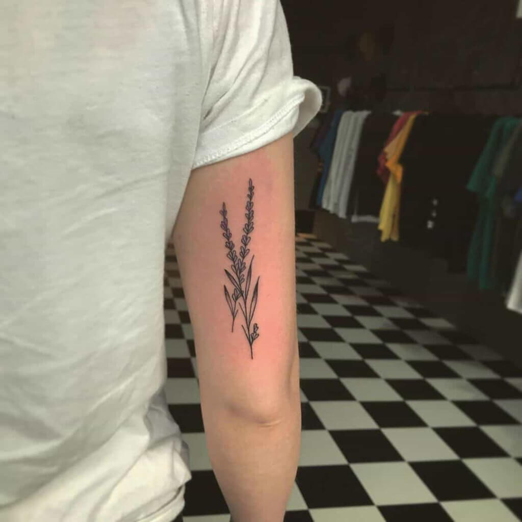 Men bicep lavender tattoo