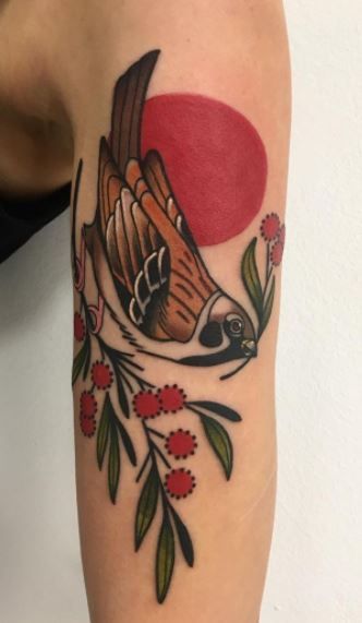 old-school sparrow bicep tattoo