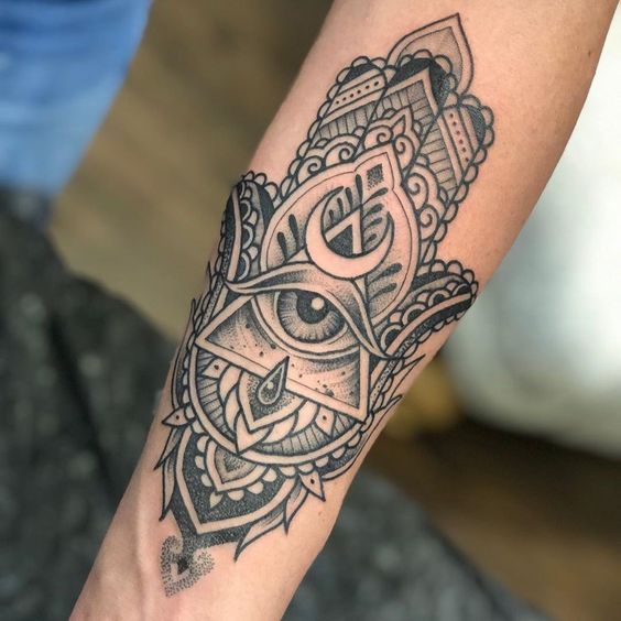 Bold Hamsa forearm tattoo design emphasizing the universal symbol of protection.