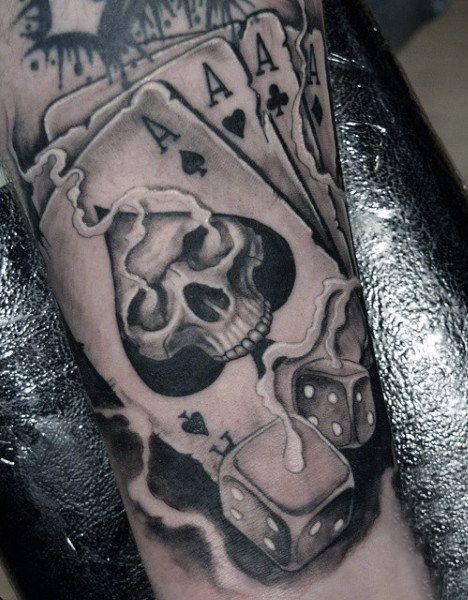 Forearm dice tattoo with a cards