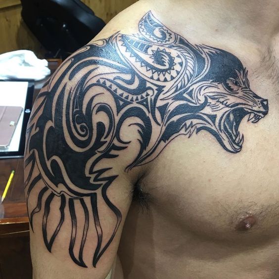 Tribal wolf shoulder tattoo