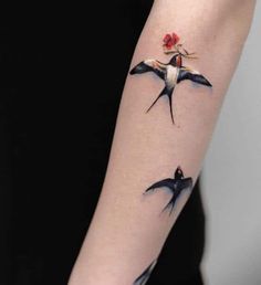 Forearm color Swallows tattoo