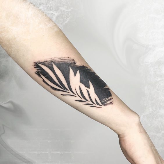 Forearm negative space tattoo