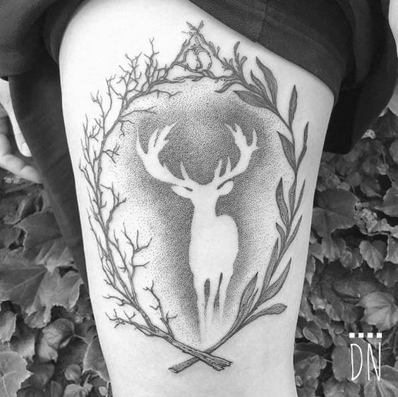 Thigh negative space tattoo