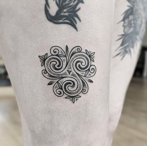 Express yourself with magical Celtic triskele tattoo