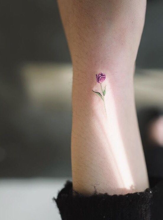 Purple tulip tattoo on the wrist