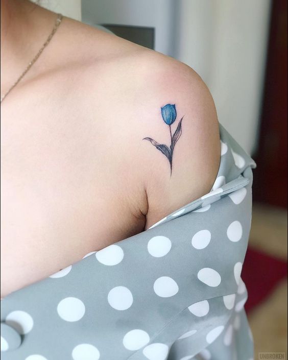 Blue tulip tattoo on the shoulder