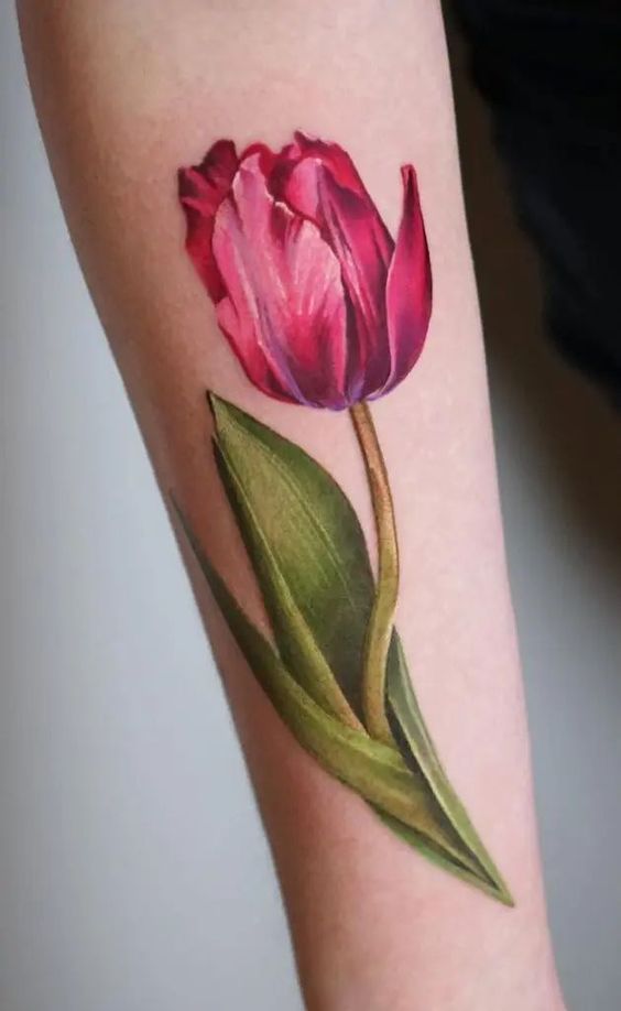 Pink tulip flower tattoo on forearm