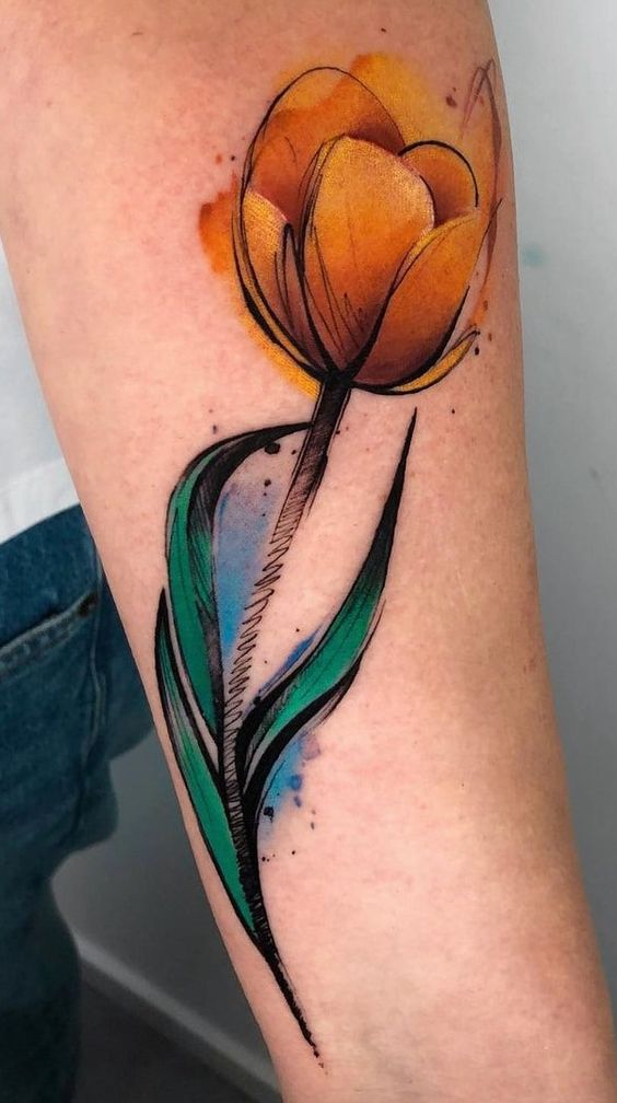 Yellow watercolor tulip flower tattoo on forearm
