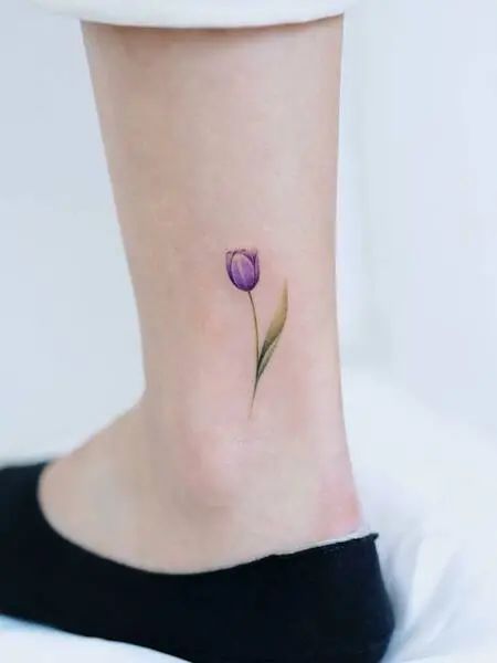 Purple tulip tattoo on the wrist
