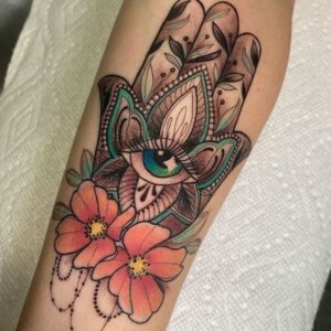 15 Hamsa tattoos as a symbol of protection and strength on the forearm 2