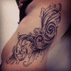 Filigree tattoo on the ribs