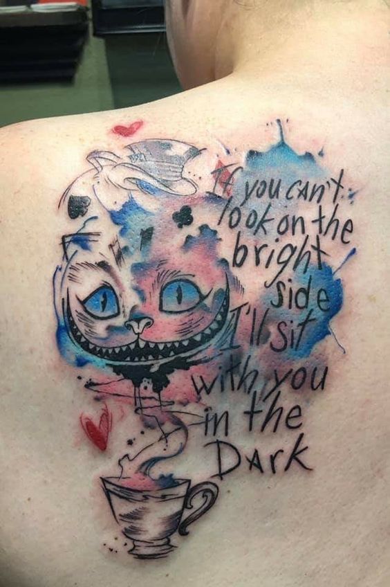 Cheshire cat tattoo on back