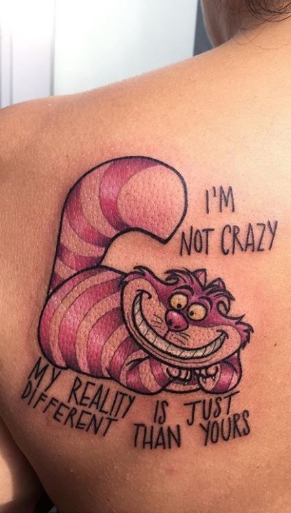 Cheshire cat tattoo with Quotes or Phrases on back