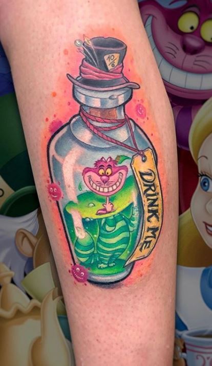 Cheshire cat tattoo on calf
