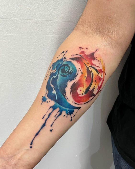Watercolor  Yin Yang tattoo on forearm