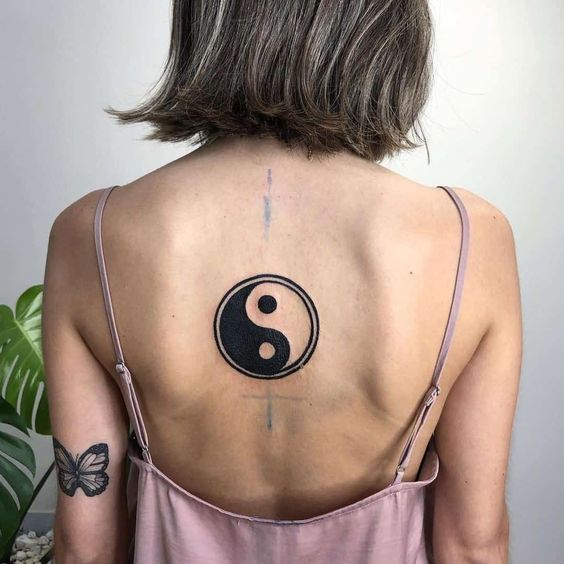 Yin Yang tattoo on the back