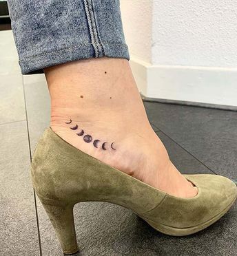 Minimalistic beauty as small moon phases tattoo