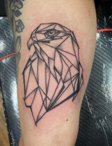 Sharp lines and powerful symbolism in geometric hawk tattoo 4