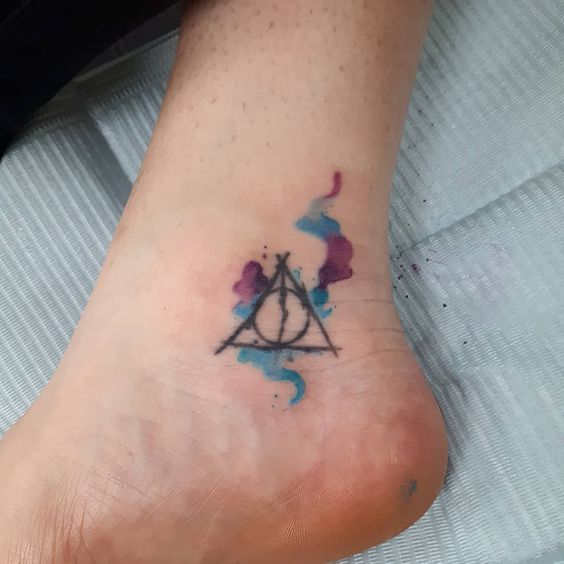 Watercolor ankle Deathly Hallows tattoos with a pop of colors 16