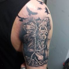 Intricate shoulder Cerberus tattoo design symbolizing the mythical guardian of the underworld.
