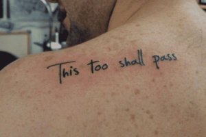 Shoulder tattoo with a This Too Shall Pass lettering and meaningful message 4